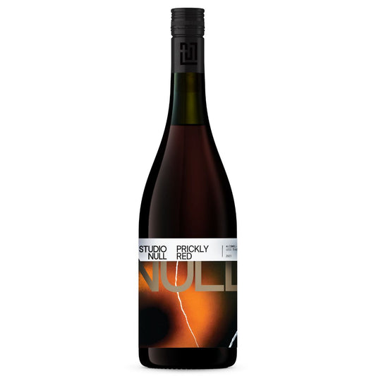 This image features a bottle of "Studio Null" Prickly Red wine. The bottle is tall with a dark tint and prominently displays the product name "Prickly Red" in bold, white letters.