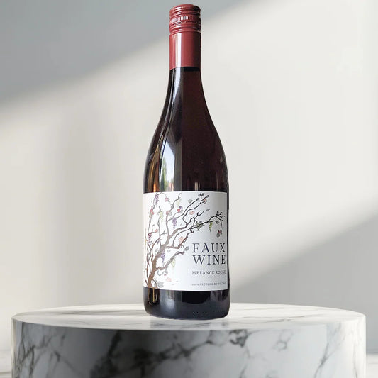 Bottle of Faux Wine on a marble surface with a neutral background