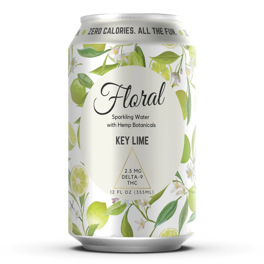 This image features a can of "Floral Sparkling Water" with a distinct Key Lime flavor. The can is adorned with a delicate and detailed floral pattern, emphasizing its all-natural approach and zero-calorie content.