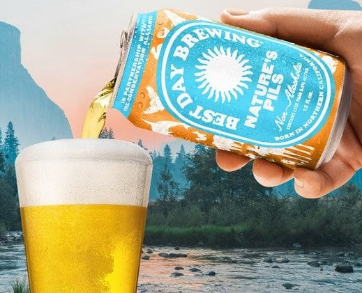 Can of Best Day Brewing Nature's Pils with a scenic background