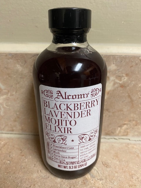 Bottle of Blackberry Lavender Molto Elixir on a tiled floor