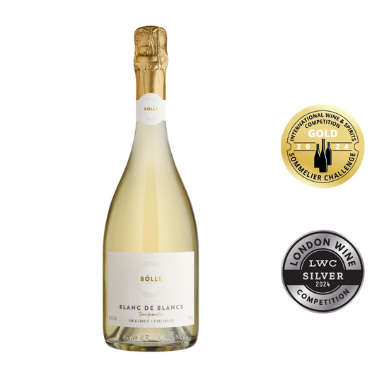A bottle of Bolle Blanc de Blancs sparkling wine with a gold and silver award seal indicating its win in the 2024 IWS Sommelier Challenge and London Wine Competition.