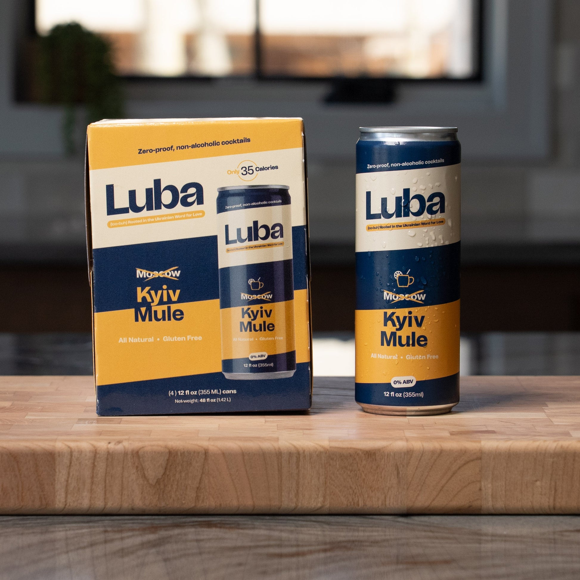 Luba Kyiv Mule can and box on a wooden surface with a blurred background