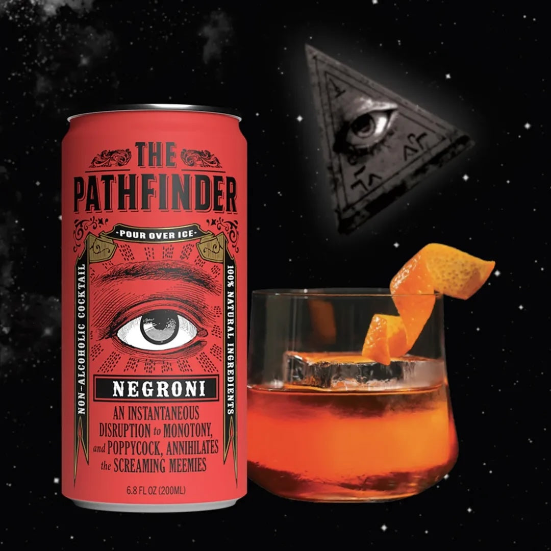 A canned beverage labeled 'The Pathfinder Negroni' is displayed next to a glass of negroni cocktail with an orange peel garnish. In the background, there is a symbol resembling an eye on a triangle.