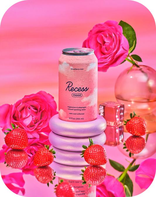 Pink can of 'Recess' with strawberries and roses on a pink background