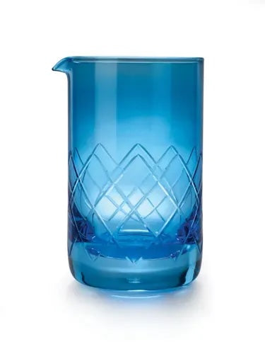Blue glass pitcher with geometric pattern on a white background